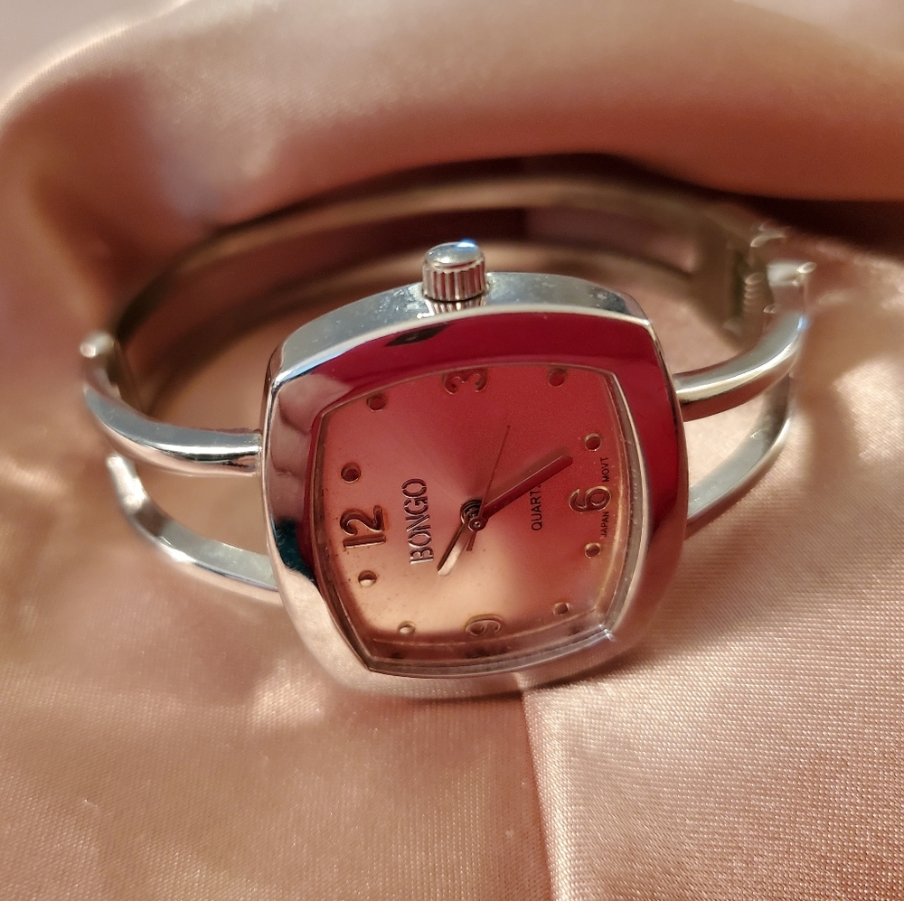 Ladies square front hinged watched.